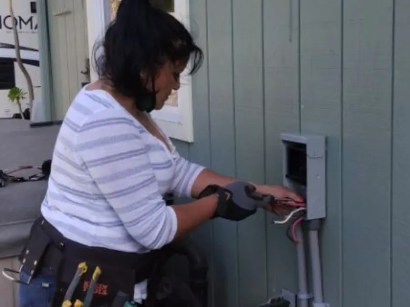 Licensed electrician wiring an exterior subpanel in Euclid